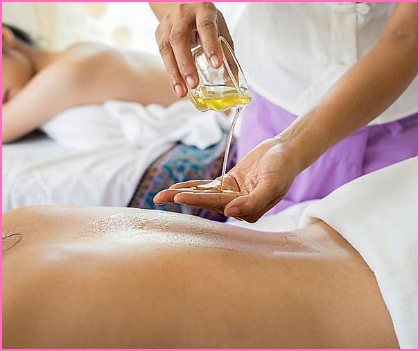 Peaceful Thai woman receiving traditional treatment
